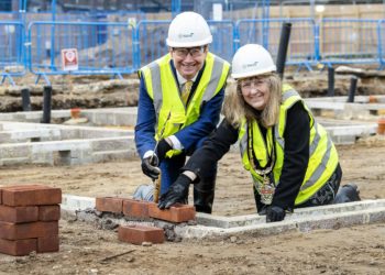The Mayor and executive member for housing laying the first set of bricks at Gorse Ride. Picture: Stewart Turkington
