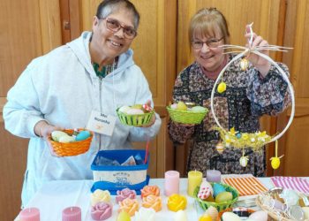 Mel Noronha and Heike Conroy with recycled candles and Easter decorations they sold for charity at St Thomas More RC Church in Twyford on Sunday