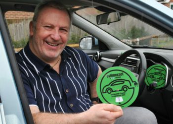 Russell Smith with the Electric Vehicle Charging Timer Disc that he has invented. Picture: Steve Smyth
