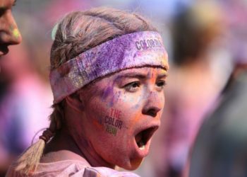 A runner covered in powder paint at a colour run event in London Picture: Jordane Mathieu on Unsplash