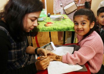 Aiza, 5, gets some henna done. Picture: Dijana Capan/DVision Images