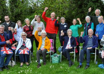 A picnic in the park was just one of All Saints Church's coronation events. Organised by All Saints and Norreys Churches, the event gets a fist in the air from party goers. Picture: Steve Smyth