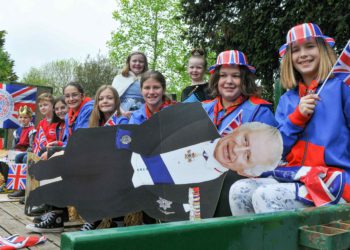 A cardboard cut-out of King Charles joined the children on one of the floats. Picture: Steve Smyth