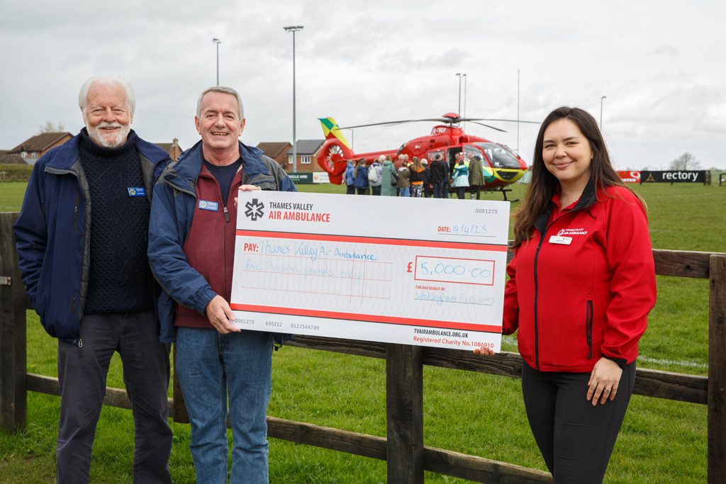 Wokingham Lions present a cheque to Thames Valley Air Ambulance for £5,000, raised from its share of the Wokingham Fireworks proceeds Picture: Mark Lord Photography