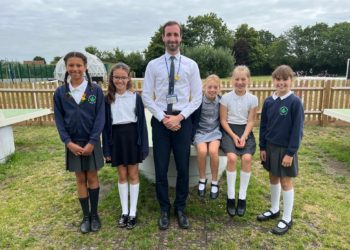 SPORTS STARS: Matt Lappin, head of PE, Year 6 and curriculum at Shinfield St Mary's Junior School, with some of the school's sports leaders. Picture: Ji-Min Lee
