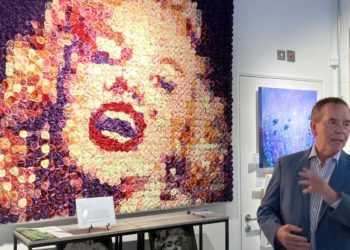 Artist Richard Young with his floral tribute to Marilyn Monroe. Picture: Emma Merchant