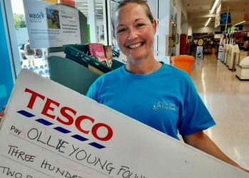 Founder of The Ollie Young Foundation, Sarah Simpson, received a donation from book sales at Tesco Wokingham's community bookshelf. Picture courtesy of Louise Jedras