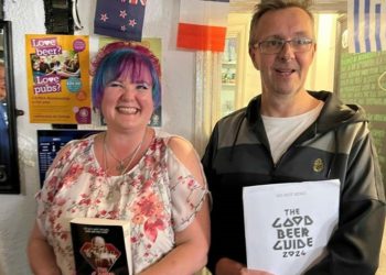 CAMRA Berkshire South East  Good Beer Guide Coordinator, Mike Tickner, presents the landlords of The Crispin pub with a copy of the 2024 edition, together with pack containing posters and a "We're In It" window sticker