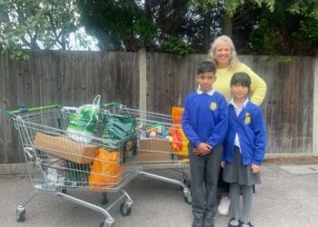 Zain and Elaine with headteacher Mrs Davies, ready to drop off a huge food donation from Winnersh Primary School. PIcture: Winnersh Primary School