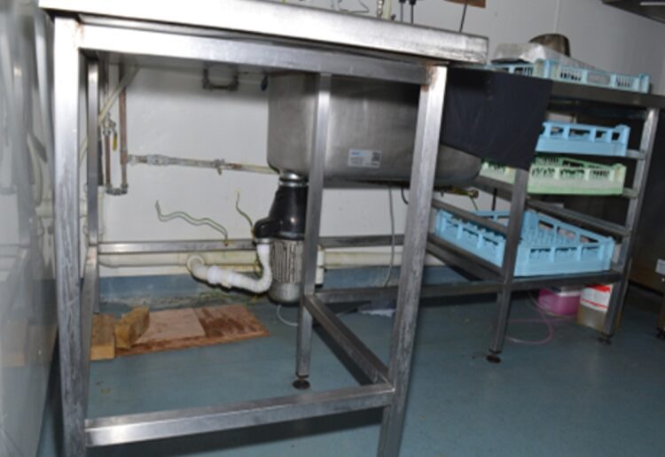 Bishops Wood Hospital kitchen area showing the sink with the macerator underneath. An exposed metal area carried an electric current which fatally electrocuted Craig Stocker