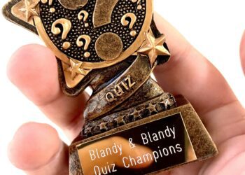 The winning team received a trophy from Blandy & Blandy