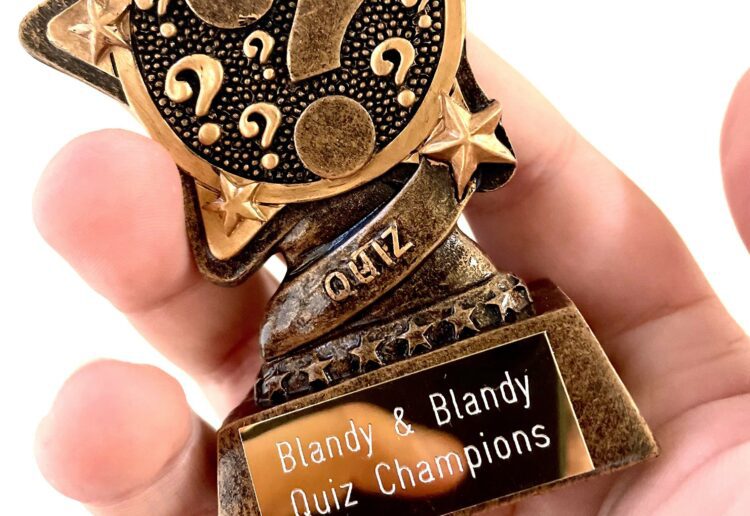 The winning team received a trophy from Blandy & Blandy
