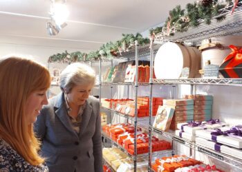 Theresa May (right) explores the Chocoholics shop when she officially opened it in Hurst in October 2022 Picture: Sue Corcoran