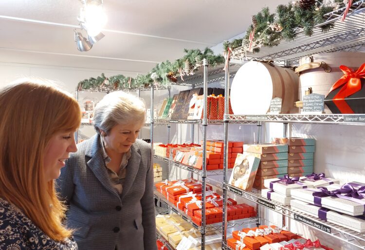Theresa May (right) explores the Chocoholics shop when she officially opened it in Hurst in October 2022 Picture: Sue Corcoran