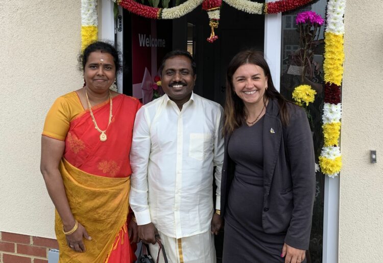 Professor Sakthi Vaiyapuri and his wife Maha Subbarao with Linden Homes? senior sales consultant Sylwia Wabia at the Hindu blessing of their new house at the Linden Homes? Langley Mead at Shinfield Meadows location in Reading.