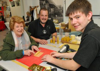 The MERL (Museum of Engish Country Life) Christmas Shopping Event last year saw Angela Francis making a candle with the help of Rob & Charlie Nickless Picture: Steve Smyth