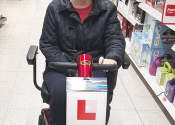 Pleased as punch, Elaine can visit the shops alone, thanks to support from WUC and W&E Lions Club, who helped her to buy a mobility scooter. Picture WUC