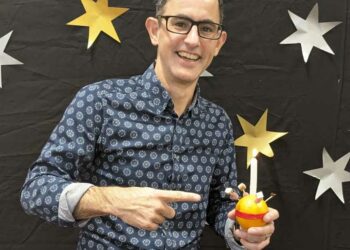 Pastor Nathan Hunt of Shinfield Community Church with a Christingle Picture: Joseph Creighton