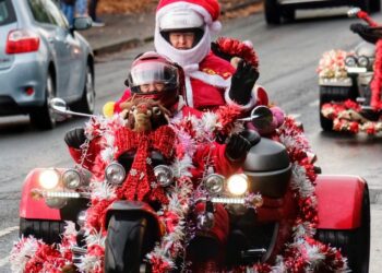 Wokingham Councillors Phil Cunnington and  delivering Children's gifts to High Close School, Wokingam on Sunday. Picture: Andrew Batt