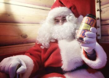 Siren welcomes Santa. Posing with some of the local produce.