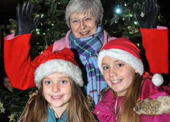 The Twyford Christmas Lights Switch-On on Sunday Evening. Theresa May MP with Amelie (8) & Lucia Farris (10).