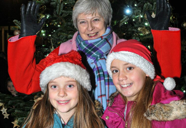 The Twyford Christmas Lights Switch-On on Sunday Evening. Theresa May MP with Amelie (8) & Lucia Farris (10).