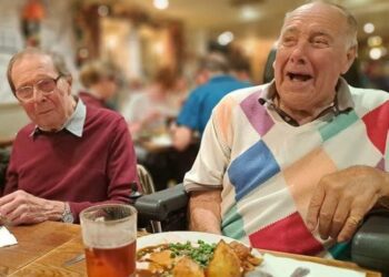Resident Michael Holdstock (left) and Les Langley (right) from RMBI Care Co. Home PrincePhilip Duke of Edinburgh Court, in Wokingham, share a laugh whilst enjoying a wonderful feast at alocal carvery.