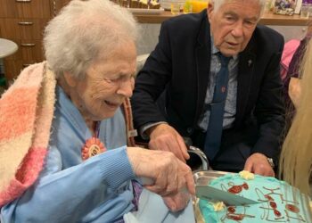 Florrie celebrates her 101st birthday by cutting her birthday cake