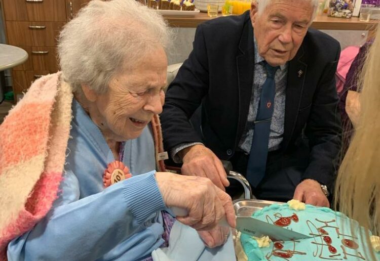 Florrie celebrates her 101st birthday by cutting her birthday cake