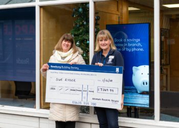 Justine Ransom (left) presents the cheque to Sue Soffe outside the Wokingham branch of Newbury Building Society. Credit: Michael Harden.
