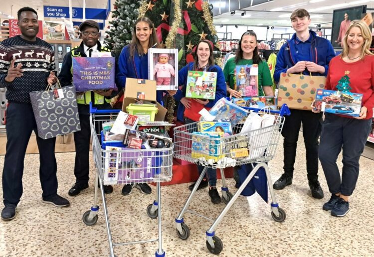 The team at Tesco Warfield with gifts donated by shoppers in the store. Giving Trees around the borough have enabled residents to help put a smile on a child's face this Christmas, through the Giving Tree campaign. Picture: Amanda Eversden, Tesco Warfield