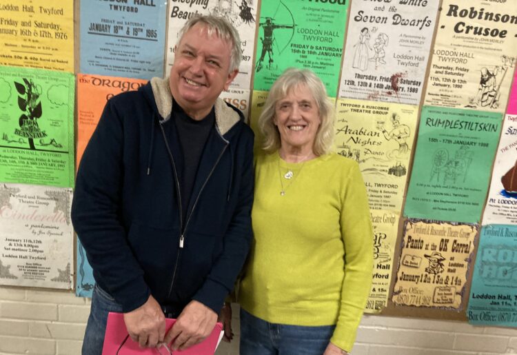 Pictured in front of historic panto posters are this year's Twyford panto are director and producer Peter and Beth Reynolds