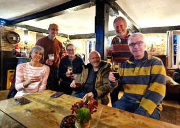 SUCCESS: Sue and Graham Slade, Chantal Roberts, Simon Farrar, Simon Roberts and Duncan Kendall at The Castle Inn Hurst celebrating their bell ringing