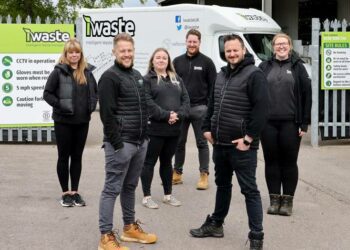Pictured are directors Sam Mountain (front left) and Sam Prentice (front right) with senior members of staff at the new headquarters in Arborfield Cross.