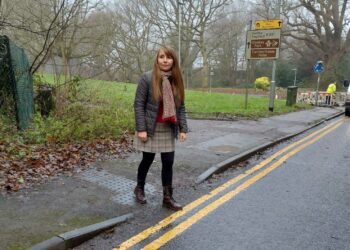 Cllr Rachel Burgess next to some uneven pavement near The Holt School. Picture: Wokingham Labour