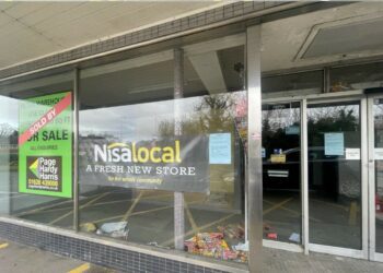Adverts for the new Nisa at the former Just Tiles shop in Woodley (Credit: Wokingham Borough Council).