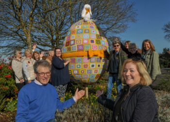 Hurst Hookers crochet a giant easter egg.David Haworth, who built the egg, and Amanda Carruthers, who came up with the idea, with members who crocheted the squares. Picture: Steve Smyth