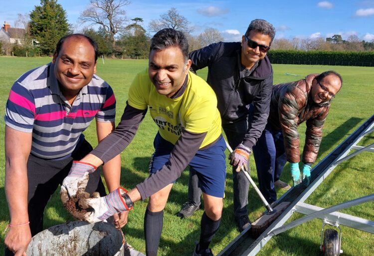 Nitin Goel, Vikas Gupta, Srini Rajasekaran, Vinay Acharya cleaning up the pitch covers at Hurst