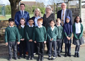 Howard Seymour, headteacher at Churchend Primary Academy, Elaine Hughes, headteacher at Hawkedon Primary School, Antoinette Butler-Willis, headteacher at South Lake Primary School, and Tom Bartlett, CEO of Orchard Learning Alliance; with pupils from Hawkedon Primary schools.