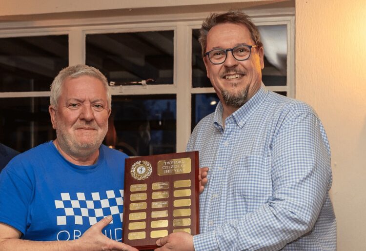Ian Wisdom, Twyford Citizen of 2023 received an award from Twyford Parish Council vice chair John Bowley. Picture: Tim Hodges Photography