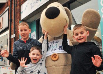 "Boofle The Bear" made a special visit to The Wild Card Shop in Wokingham to help celebrate its 35th anniversary. Pictured with him are Finnbar (9), Ted (4) and Eddie Reynolds (7) Picture: Steve Smyth