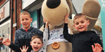 "Boofle The Bear" made a special visit to The Wild Card Shop in Wokingham to help celebrate its 35th anniversary. Pictured with him are Finnbar (9), Ted (4) and Eddie Reynolds (7) Picture: Steve Smyth