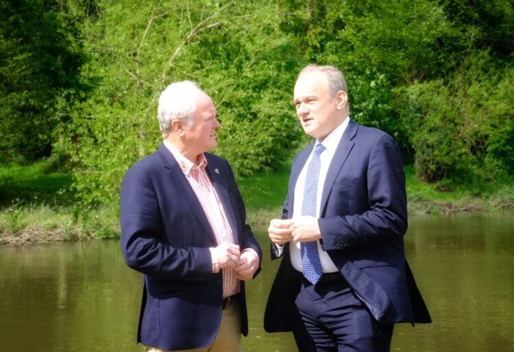 Sir Ed Davey (right) with Clive Jones, on the banks of the River Loddon. Pic: Andrew Batt.