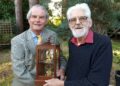 Neil Doody (left) presenting the VC Trophy to Colin Cresswell in 2023, in recognition of tilling service shown by the Cresswells Garage business over 100 years. Pic: Finchampsted Society.