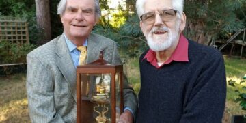 Neil Doody (left) presenting the VC Trophy to Colin Cresswell in 2023, in recognition of tilling service shown by the Cresswells Garage business over 100 years. Pic: Finchampsted Society.