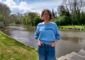Catherine Abbott in her garden by the river Loddon, where she says she has got used to seeing raw sewage. Credit: LDRS.