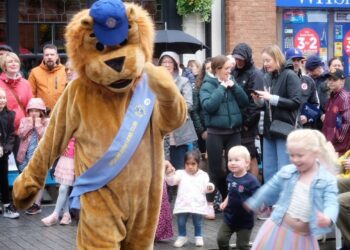 The Wokigham Lion's Club mascot was seen dancing with young visitors to Wokingham's May Fayre. Picture: Andrew Batt