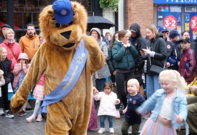 The Wokigham Lion's Club mascot was seen dancing with young visitors to Wokingham's May Fayre. Picture: Andrew Batt