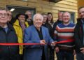 Gary Cowan, retiring borough councillor, cuts the ribbon watched by other councillors. Pic: Steve Smyth.
