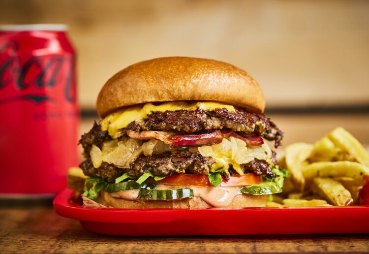 Honest Burgers' special for May is the California Burger: two smashed beef patties cooked with French mustard, and served with bacon, tomato, lettuce and pickles  Picture: Steve Ryan